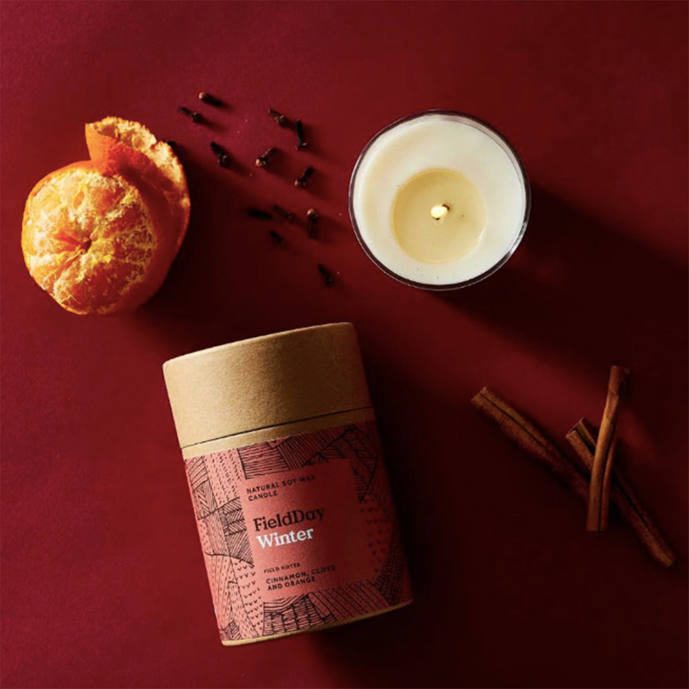 winter candle with cinnamon and glove fragrances lifestyle image